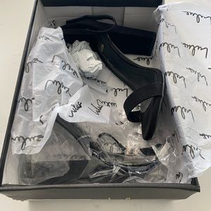 Brand new in box black heels